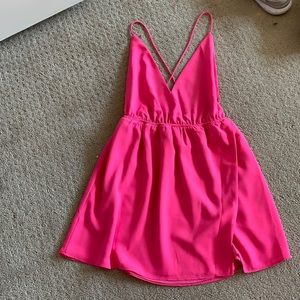 Revolve pink mini dress with open cross back.